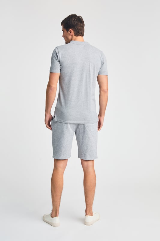 This 2-piece Tokyo Laundry outfit set includes a cotton polo shirt and matching brushed-back fleece shorts. Both pieces feature a soft-handle print for added style and comfort. Ideal for casual wear, this set offers a coordinated, laid-back look with premium fabric and design. Perfect for everyday lounging or outings.