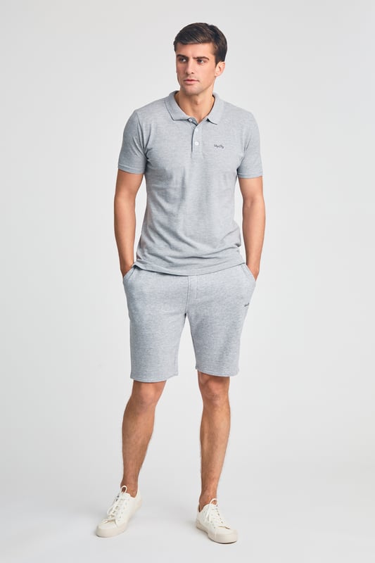 This 2-piece Tokyo Laundry outfit set includes a cotton polo shirt and matching brushed-back fleece shorts. Both pieces feature a soft-handle print for added style and comfort. Ideal for casual wear, this set offers a coordinated, laid-back look with premium fabric and design. Perfect for everyday lounging or outings.