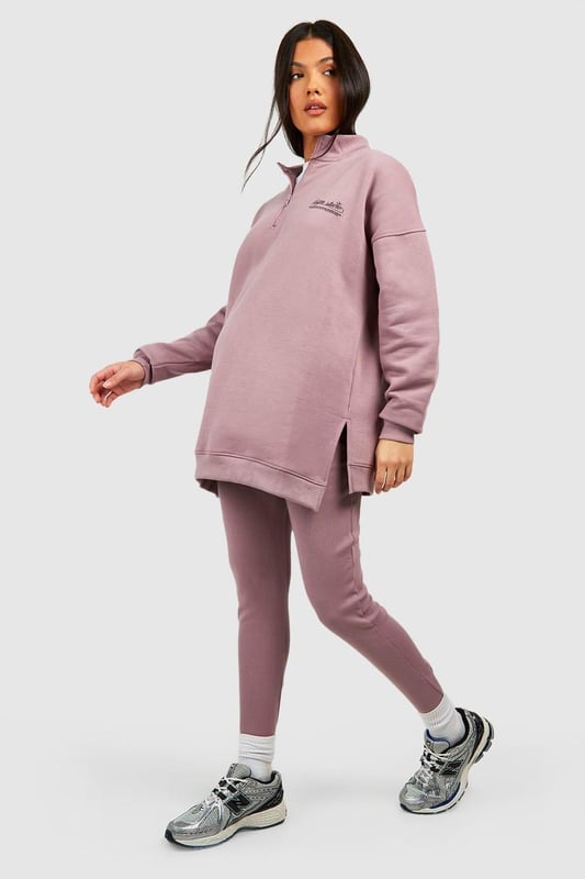 Maternity-friendly oversized sweat top with half-zip design
        Comfortable rib leggings for growing bump
        Coordinated set for effortless style
        Practical front pocket on sweat top
        Versatile for various casual occasions
    
    Embrace comfort and style during your pregnancy with this chic maternity tracksuit set from Boohoo. The oversized sweat top features a trendy half-zip design, perfect for adjustable ventilation and easy nursing access. Paired with ribbed leggings that accommodate your growing bump, this set offers both flexibility and fashion-forward appeal. Style the top with the zip partially undone, revealing a contrasting layer underneath for added interest. For a laid-back weekend look, team with chunky trainers and a crossbody bag. Alternatively, dress it up for a casual lunch date by adding statement earrings and swapping trainers for stylish slip-on mules. This versatile set is ideal for family gatherings, relaxed outings with friends, or simply lounging at home in comfort and style.