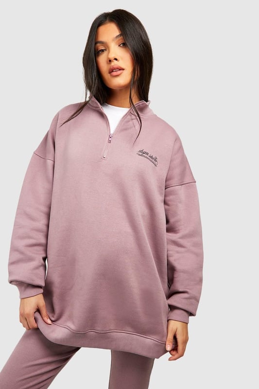 Maternity-friendly oversized sweat top with half-zip design
        Comfortable rib leggings for growing bump
        Coordinated set for effortless style
        Practical front pocket on sweat top
        Versatile for various casual occasions
    
    Embrace comfort and style during your pregnancy with this chic maternity tracksuit set from Boohoo. The oversized sweat top features a trendy half-zip design, perfect for adjustable ventilation and easy nursing access. Paired with ribbed leggings that accommodate your growing bump, this set offers both flexibility and fashion-forward appeal. Style the top with the zip partially undone, revealing a contrasting layer underneath for added interest. For a laid-back weekend look, team with chunky trainers and a crossbody bag. Alternatively, dress it up for a casual lunch date by adding statement earrings and swapping trainers for stylish slip-on mules. This versatile set is ideal for family gatherings, relaxed outings with friends, or simply lounging at home in comfort and style.