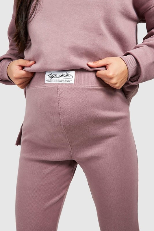 Maternity-friendly oversized sweat top with half-zip design
        Comfortable rib leggings for growing bump
        Coordinated set for effortless style
        Practical front pocket on sweat top
        Versatile for various casual occasions
    
    Embrace comfort and style during your pregnancy with this chic maternity tracksuit set from Boohoo. The oversized sweat top features a trendy half-zip design, perfect for adjustable ventilation and easy nursing access. Paired with ribbed leggings that accommodate your growing bump, this set offers both flexibility and fashion-forward appeal. Style the top with the zip partially undone, revealing a contrasting layer underneath for added interest. For a laid-back weekend look, team with chunky trainers and a crossbody bag. Alternatively, dress it up for a casual lunch date by adding statement earrings and swapping trainers for stylish slip-on mules. This versatile set is ideal for family gatherings, relaxed outings with friends, or simply lounging at home in comfort and style.