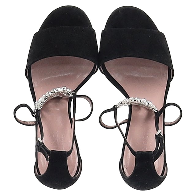 VINTAGE, RRP AS NEW
Step into high-impact elegance with the Gucci Interlocking G Ankle Strap Sandals. Crafted from plush black suede, these sandals dazzle with crystal embellishments that catch the light from every angle. The standout feature—a crystal-encrusted GG logo—adds signature sparkle, while the wrap-around ankle straps bring sensuality and secure comfort. Designed for those who move with confidence, these heels are pure evening glamour with unmistakable Gucci DNA.


Gucci Interlocking G Embellished Ankle Strap Sandals in Black Suede 
Condition: Very good
Signs of wear: Minor markings, Lightly used but very well maintained. Minor mark at soles & creasing, light scuffing at the soles and heels.
Packaging: None
Color: black
Material: Suede | suede
Size: EU | 36
Measurements: Heel height: 85; Insole length: 260
SKU: NAPPUGBSH492833W