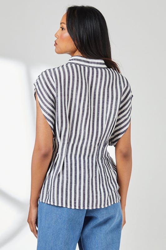 Crafted from a breathable cotton-linen blend for exceptional comfort in warm weather
        Distinctive pleat detail creates a flattering cinched waist silhouette
        Relaxed cap sleeves offer effortless movement and contemporary styling
        Classic button-through design with smart collar for versatile styling options
        Timeless stripe pattern adds visual interest to this wardrobe essential
    
    This Principles striped shirt combines casual comfort with refined detailing for everyday sophistication. The pleated waist creates a feminine silhouette that flatters your figure without sacrificing comfort. Style with wide-leg denim trousers as shown for a balanced daytime look perfect for weekend brunches or casual gatherings. For a more polished appearance, tuck the front into tailored linen trousers and add leather sandals. The cotton-linen fabric ensures breathability during warmer months whilst maintaining structure throughout the day. This versatile piece transitions effortlessly from office to outdoor caf, making it an indispensable addition to your casual wardrobe. Accessorise with simple gold-toned jewellery to complement the classic nautical-inspired pattern for family gatherings or informal social events.