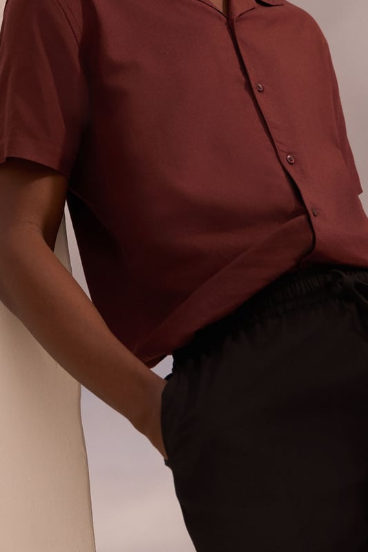 Resort-style shirt with classic camp collar design for a relaxed aesthetic
        Short sleeves with clean-finished edges for a neat, contemporary look
        Textured fabric blend featuring linen for breathability and comfort
        Straight hem with side splits allowing for versatile styling options
        Button-through front with tonal buttons for a sophisticated finish
    
    This Burton resort shirt combines casual comfort with effortless style, perfect for the modern man who appreciates classic design. The textured fabric offers a natural drape that looks equally impressive worn open over a plain t-shirt or buttoned up for a smarter appearance. Style with tailored shorts and leather sandals for warm-weather socialising, or pair with chino trousers and trainers for casual Friday at the office. The versatile design transitions seamlessly from daytime barbecues to evening drinks at your local, making it a wardrobe essential for the British summer. For cooler evenings, layer under a lightweight bomber jacket or unstructured blazer to maintain that relaxed yet put-together look that Burton is known for. Machine washable at 30 degrees, this shirt offers practicality alongside its undeniable style credentials.