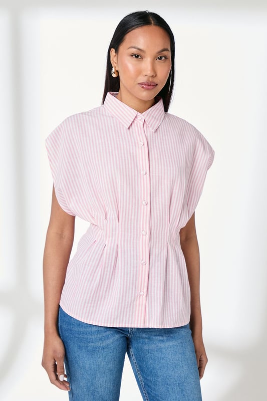 Elegant striped shirt with distinctive pleat detailing for a flattering silhouette
        Crafted from a cotton-linen blend for breathable comfort throughout the day
        Classic collared neckline with full button-through fastening
        Relaxed cap sleeves create a contemporary, effortless look
        Cinched waist pleats add structure and feminine shaping
    
    This Principles striped shirt combines timeless style with modern detailing, making it a versatile addition to your wardrobe. The structured pleats create a beautifully tailored effect at the waist, whilst the relaxed cap sleeves offer a contemporary twist on a classic design. Style with straight-leg jeans and leather sandals for casual weekend brunches, or tuck into tailored trousers with ballet flats for a polished office ensemble. The cotton-linen blend ensures this piece remains comfortable for all-day wear, whether you're running errands or meeting friends for coffee. Layer under a lightweight cardigan when the temperature drops, or wear open over a simple vest top for a more relaxed approach. This shirt works beautifully for family gatherings or casual daytime events where understated elegance is key.