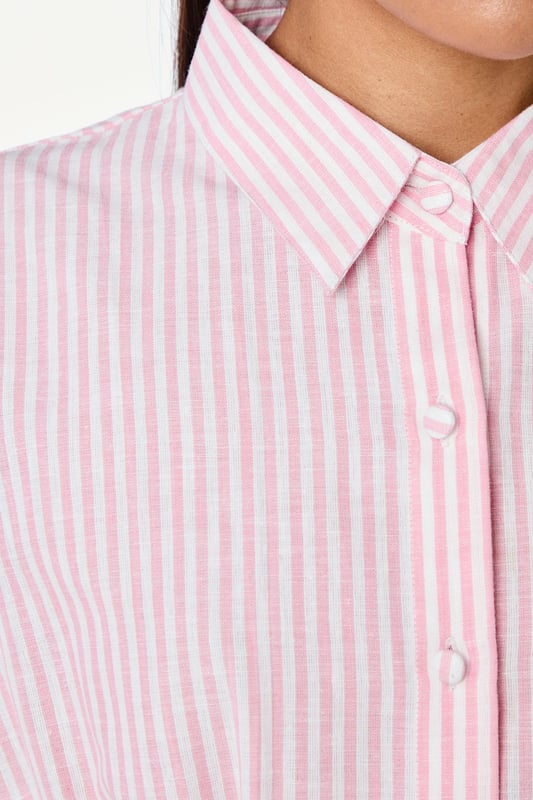 Elegant striped shirt with distinctive pleat detailing for a flattering silhouette
        Crafted from a cotton-linen blend for breathable comfort throughout the day
        Classic collared neckline with full button-through fastening
        Relaxed cap sleeves create a contemporary, effortless look
        Cinched waist pleats add structure and feminine shaping
    
    This Principles striped shirt combines timeless style with modern detailing, making it a versatile addition to your wardrobe. The structured pleats create a beautifully tailored effect at the waist, whilst the relaxed cap sleeves offer a contemporary twist on a classic design. Style with straight-leg jeans and leather sandals for casual weekend brunches, or tuck into tailored trousers with ballet flats for a polished office ensemble. The cotton-linen blend ensures this piece remains comfortable for all-day wear, whether you're running errands or meeting friends for coffee. Layer under a lightweight cardigan when the temperature drops, or wear open over a simple vest top for a more relaxed approach. This shirt works beautifully for family gatherings or casual daytime events where understated elegance is key.