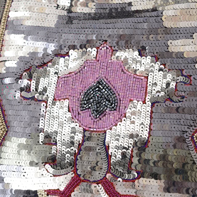 Isabel Marant embroiders this silvered Hanelis mini skirt with shimmering metallic sequins, creating a geometric floral pattern for a modern after-dark mood