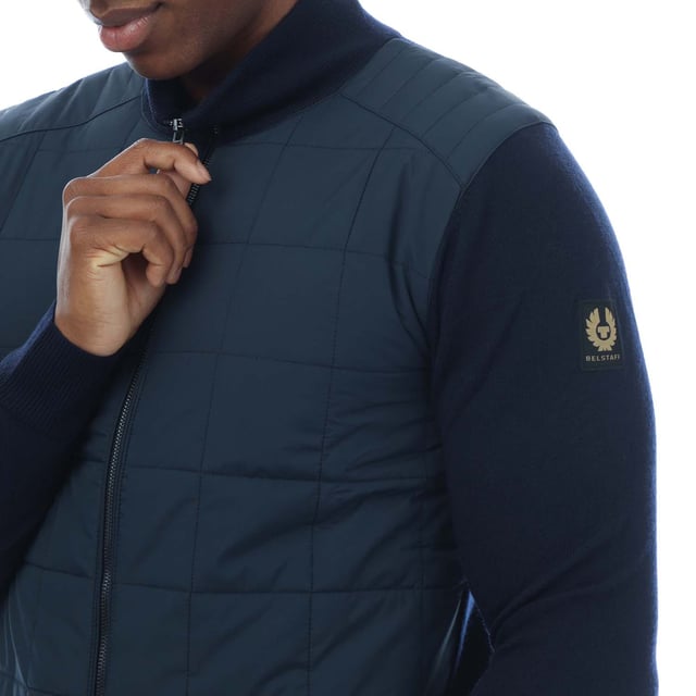Mens Belstaff Kelbrook Zip Cardigan in navy.- Stand-up collar.- Exposed two-way zip closure with signature Belstaff zip hardware.- Ribbed collar  cuff & hem.- Quilted chest for added warmth.- Slim fit.- Body: 100% Wool. Woven: 100% Polyester.- Ref: 105303WSNVY