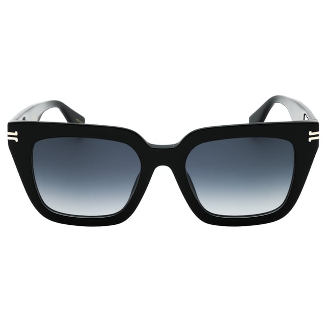 Discover the perfect blend of style and sophistication with the Marc Jacobs MJ 1083/S 0807 9O Black/Grey Gradient Sunglasses. These sunglasses feature a sleek black frame paired with elegant grey gradient lenses, offering both eye protection and a modern aesthetic. Designed for comfort and durability, they are ideal for daily wear or special occasions. Elevate your look effortlessly while shielding your eyes from harmful UV rays with this iconic accessory that embodies luxury and contemporary fashion. Make a statement wherever you go with these timeless Marc Jacobs sunglasses. Size 52X19X140, Material 100% Acetate. Made In Italy. Sunglasses come with branded case and cleaning cloth