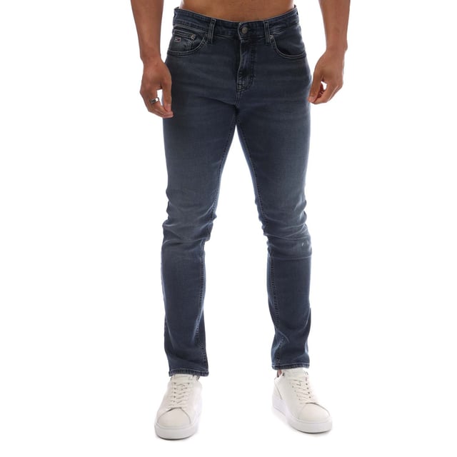 Mens Tommy Jeans Scanton Faded Slim Fit Jeans in denim washed blue - black.- 5-pocket construction.- Zip fly and button fastening.- Tommy Jeans badge at back waist.- Embroidered Tommy Jeans flag logo on coin and rear right pockets.- Fading on knees- Whiskering on thighs and on back of knees.- Slim fit.- Regular inside leg length approx. 32  Long inside leg length approx. 34  Extra long inside leg length approx. 36.- 98% Cotton  2% Elastane.  Machine washable.- Ref: DM0DM210061BZMeasurements are intended for guidance only.