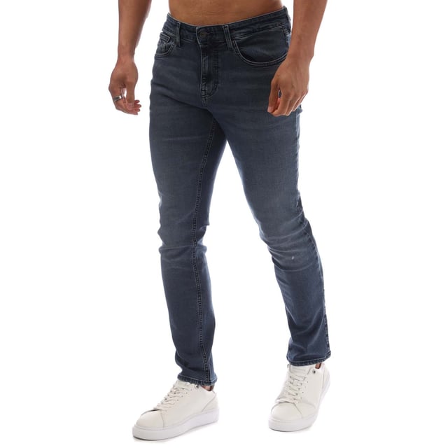 Mens Tommy Jeans Scanton Faded Slim Fit Jeans in denim washed blue - black.- 5-pocket construction.- Zip fly and button fastening.- Tommy Jeans badge at back waist.- Embroidered Tommy Jeans flag logo on coin and rear right pockets.- Fading on knees- Whiskering on thighs and on back of knees.- Slim fit.- Regular inside leg length approx. 32  Long inside leg length approx. 34  Extra long inside leg length approx. 36.- 98% Cotton  2% Elastane.  Machine washable.- Ref: DM0DM210061BZMeasurements are intended for guidance only.