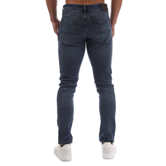 Mens Tommy Jeans Scanton Faded Slim Fit Jeans in denim washed blue - black.- 5-pocket construction.- Zip fly and button fastening.- Tommy Jeans badge at back waist.- Embroidered Tommy Jeans flag logo on coin and rear right pockets.- Fading on knees- Whiskering on thighs and on back of knees.- Slim fit.- Regular inside leg length approx. 32  Long inside leg length approx. 34  Extra long inside leg length approx. 36.- 98% Cotton  2% Elastane.  Machine washable.- Ref: DM0DM210061BZMeasurements are intended for guidance only.