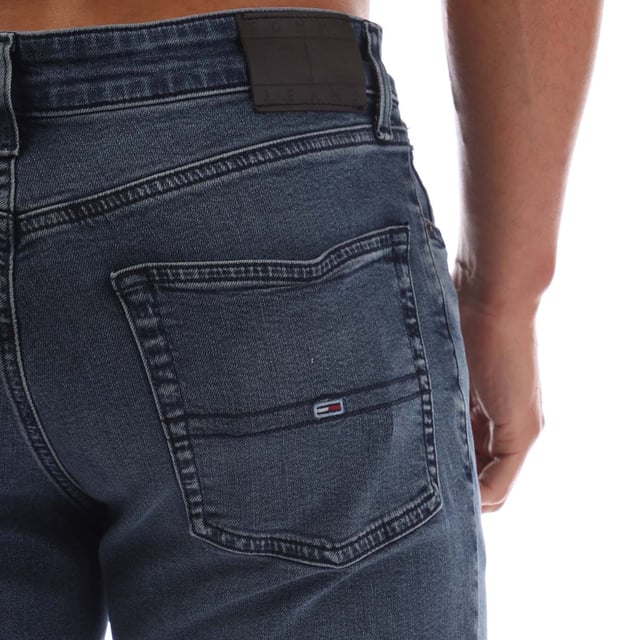 Mens Tommy Jeans Scanton Faded Slim Fit Jeans in denim washed blue - black.- 5-pocket construction.- Zip fly and button fastening.- Tommy Jeans badge at back waist.- Embroidered Tommy Jeans flag logo on coin and rear right pockets.- Fading on knees- Whiskering on thighs and on back of knees.- Slim fit.- Regular inside leg length approx. 32  Long inside leg length approx. 34  Extra long inside leg length approx. 36.- 98% Cotton  2% Elastane.  Machine washable.- Ref: DM0DM210061BZMeasurements are intended for guidance only.