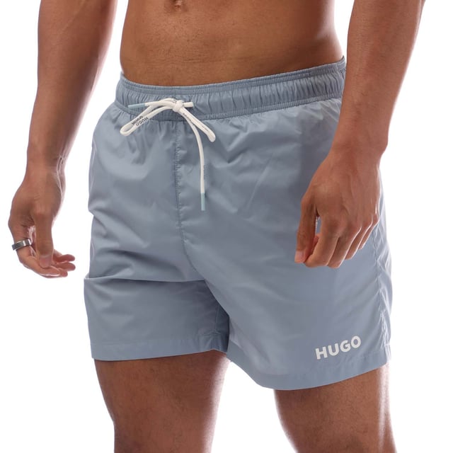 Mens Hugo Haiti Contrast Logo Swim Shorts in blue.- Elastic waistband with drawstring.- Side pockets.- Back pocket.- Quick-dry material.- 100% Polyamide.- Ref: 50469312483