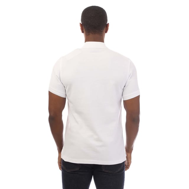 Mens Belstaff Cotton Piqué Polo Shirt in white.- Ribbed polo collar.- Two button placket.- Short sleeves with ribbed cuffs.- Embroidered Phoenix logo patch at left chest.- Uneven vented hem.- Textured cotton piqué made from organically grown cotton.- Regular fit.- Body: 100% Cotton.  Rib: 100% Cotton.  Machine washable.- Ref: 101516WHITE