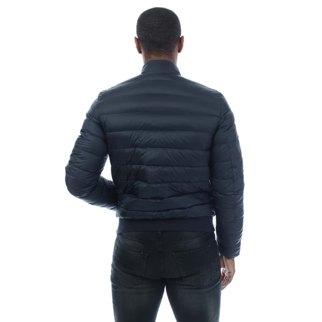 Mens Belstaff Circuit Jacket in dark ink.- Stand collar with adjustable throat latch.- Centre front zip closure.- Elasticated inner cuffs.- Rib at hem with racked stitch detailing.- Belstaff phoenix patch on left sleeve.- Two multi-stitch side pockets and one inside pocket with press-stud closures.- High-density  water-repellent nylon fabric.- High warmth to weight ratio.- Lightweight and compressible.- 750 fill power down.- 100% RDS certified down and feather.- Shell: 100% polyamide  Lining: 100% polyamide.  Filling: 90% white duck down  10% white duck feather.  Rib: 90% cotton  8% polyester  2% elastane.  Machine washable.- Ref: 105293DKINK