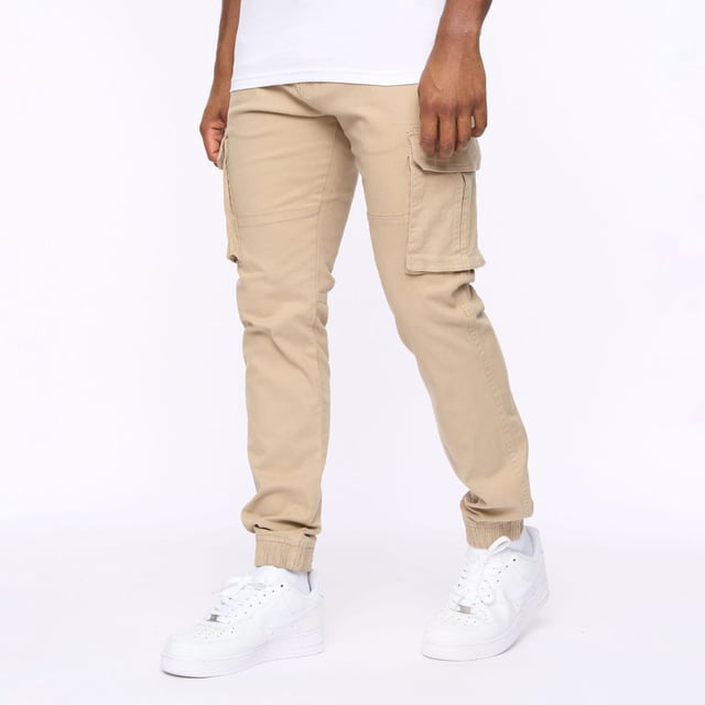 Presenting our men's straight cargo pants  featuring a top button fastening and scooped front pocket mouths for added convenience. These pants also include button-fastened cargo pockets and hidden button-fastened back pocket flaps for secure storage. Complete with a back waist leather patch.