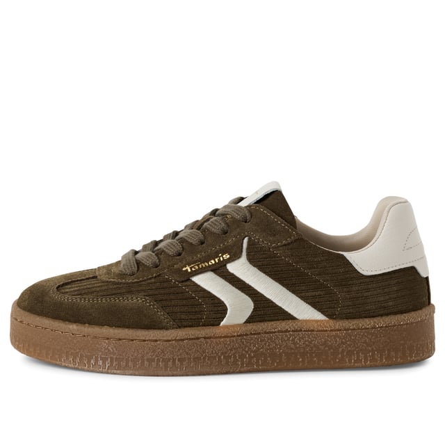 Voeg een vleugje luxe toe aan je dagelijkse stijl met deze modieuze sneakers van Tamaris. Deze veterschoenen zijn gemaakt van een hoogwaardige mix van zacht suède en hebben strepen voor extra stijl. Het sportieve silhouet is verfijnd met een strakke, moderne afwerking, waardoor ze perfect zijn voor zowel casual dagen als chique stedelijke uitjes. Bovenmateriaal: Hoogwaardige mix van suède en textiel Voering & binnenzool: Zacht textiel voor de hele dag comfort Buitenzool: Synthetische zool met grip voor zelfverzekerde stappen Haktype & hoogte: Zonder hak, met een zool van 30 mm voor subtiele verhoging Schachthoogte: 6,5 cm Schoentype: Vetersneakers voor dames