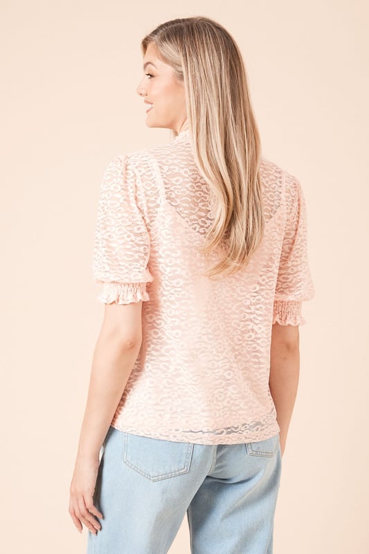 Intricate leopard lace pattern for a sophisticated look
        High neckline with delicate ruffle detail
        Half sleeves with subtle puff for added elegance
        Semi-sheer overlay with built-in camisole for modesty
        Versatile design suitable for various casual occasions
    
    This charming Half Sleeve Leopard Lace Blouse from Dorothy Perkins is the perfect addition to your wardrobe for those who appreciate a touch of femininity in their everyday style. The intricate leopard lace pattern adds a subtle yet eye-catching element, while the high neckline with its delicate ruffle detail provides a modest and refined look. Pair this versatile top with your favourite wide-leg jeans and a brown leather belt for a chic brunch ensemble. For family gatherings or casual outings, team it with tailored trousers and ballet flats. The semi-sheer overlay combined with the built-in camisole strikes the perfect balance between allure and comfort, making it an ideal choice for the fashion-conscious woman who values both style and practicality in her wardrobe.