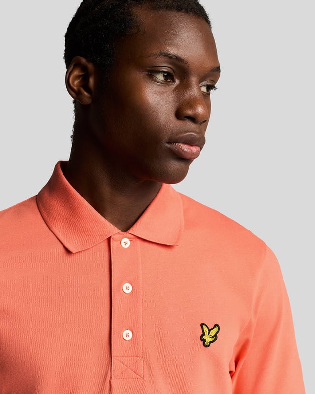It’s a wardrobe essential that will be pulled out on weekends, dress down days at work, for nights out and even for days on the golf course. Our plain Lyle & Scott polo shirt is such a classic that it barely needs an introduction. It’s made from cotton-blend jersey with a little added stretch. - Classic collar 
- Front button fastening 
- Short sleeves
- Composition: 97% cotton, 3% elastane