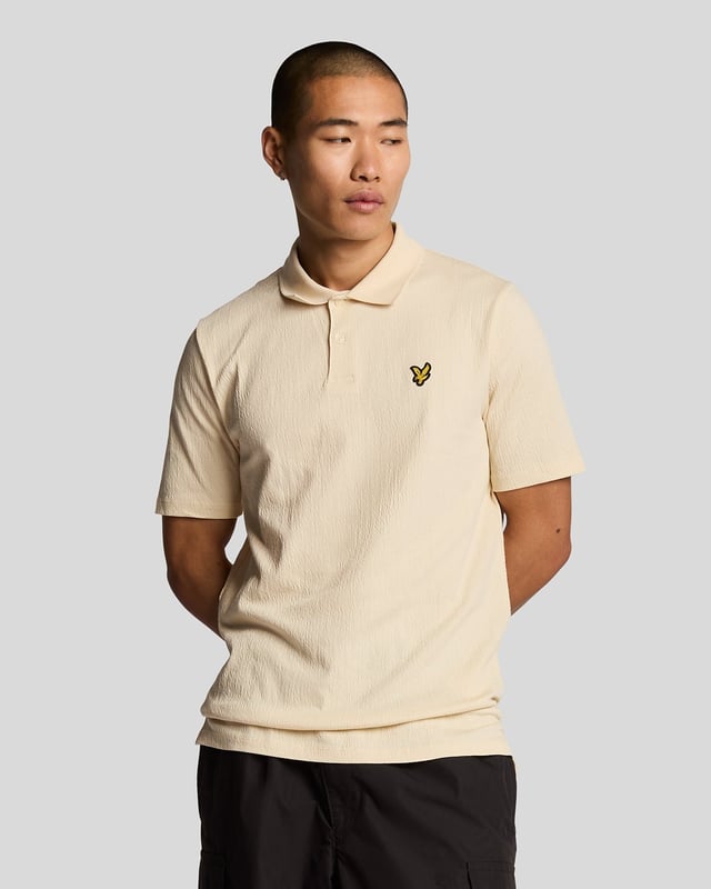 Introducing the Crepe Polo Shirt, a pinnacle of sophistication in our Spring menswear collection. This elegant piece features a refined relaxed fit and is crafted from a luxurious blend of 98% cotton and 2% elastane, ensuring ultimate comfort and mobility. Thoughtfully designed with a two-button placket and adorned with the distinctive Golden Eagle tab on the left chest, this polo exemplifies timeless style and versatility.

- Composition: 98% Cotton, 2% Elastane
- Fit: Relaxed
- Logo Branding: Golden Eagle tab
- Logo Placement: Left chest
- Versatile styling for casual and semi-formal occasions

Elevate your wardrobe with this sophisticated polo, perfect for the discerning gentleman this spring.