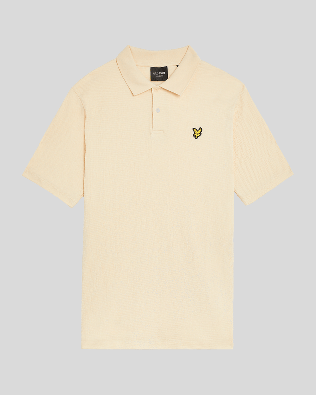 Introducing the Crepe Polo Shirt, a pinnacle of sophistication in our Spring menswear collection. This elegant piece features a refined relaxed fit and is crafted from a luxurious blend of 98% cotton and 2% elastane, ensuring ultimate comfort and mobility. Thoughtfully designed with a two-button placket and adorned with the distinctive Golden Eagle tab on the left chest, this polo exemplifies timeless style and versatility.

- Composition: 98% Cotton, 2% Elastane
- Fit: Relaxed
- Logo Branding: Golden Eagle tab
- Logo Placement: Left chest
- Versatile styling for casual and semi-formal occasions

Elevate your wardrobe with this sophisticated polo, perfect for the discerning gentleman this spring.