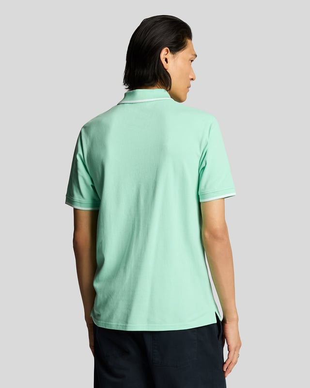 When people think of Lyle & Scott, they often think of polo shirts, so it stands to reason that we create the best polo shirts season after season. This one is cut for a classic fit in cotton jersey with a bit of added stretch and is finished with contrast tipping at the collar and cuffs for a slightly preppy look. - Classic collar 
- Front button fastening 
- Short sleeves 
- Tipped collar and cuffs
- Composition: 97% cotton, 3% elastane