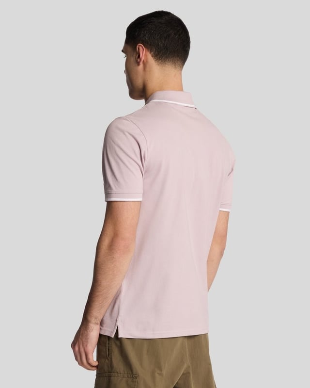 When people think of Lyle & Scott, they often think of polo shirts, so it stands to reason that we create the best polo shirts season after season. This one is cut for a classic fit in cotton jersey with a bit of added stretch and is finished with contrast tipping at the collar and cuffs for a slightly preppy look. - Classic collar 
- Front button fastening 
- Short sleeves 
- Tipped collar and cuffs
- Composition: 97% cotton, 3% elastane