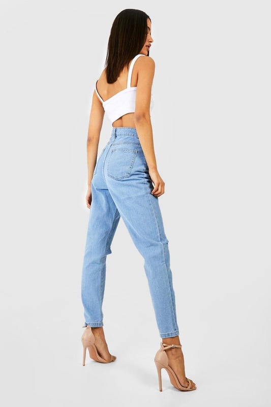 A classic go-to silhouette made from rigid and durable denim, the mom jean has become a wardrobe essential for every girl. Whether you're styling them day to day or wearing on a night out with heels, we have mom jeans to suit your vibe. Our ripped mom jeans let you get daring, just try a bum rip or a simple busted knee to serve everyday attitude. Step out in high waisted mom jeans for a low-key look that stays fresh all season. This is no regular denim staple - it's over to you to create the look.Style: Mom JeansFabric: Denim