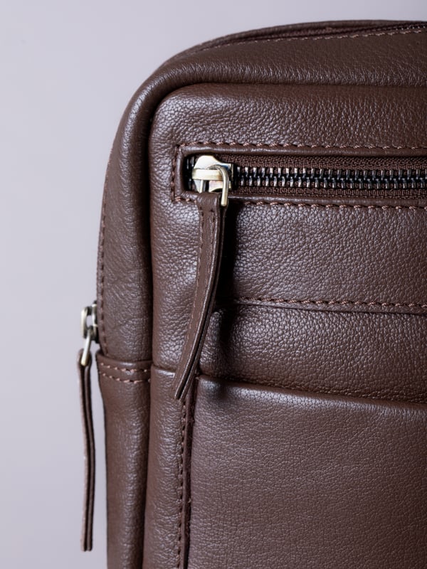 Crafted from real leather and built with thoughtful details, the Explorer Messenger Bag is made for life on the move. A checked fabric lining adds a refined finish, while a front slip pocket with magnetic fastening, plus front and rear zip pockets, keep essentials close to hand.
The main compartment fits an 11&rdquo; iPad with room to spare, and includes slip and zip pockets for valuables like passports and wallets. The adjustable strap can be worn on the shoulder or cross-body, thanks to dual D-ring settings - comfortable, versatile, and ready for work or travel.