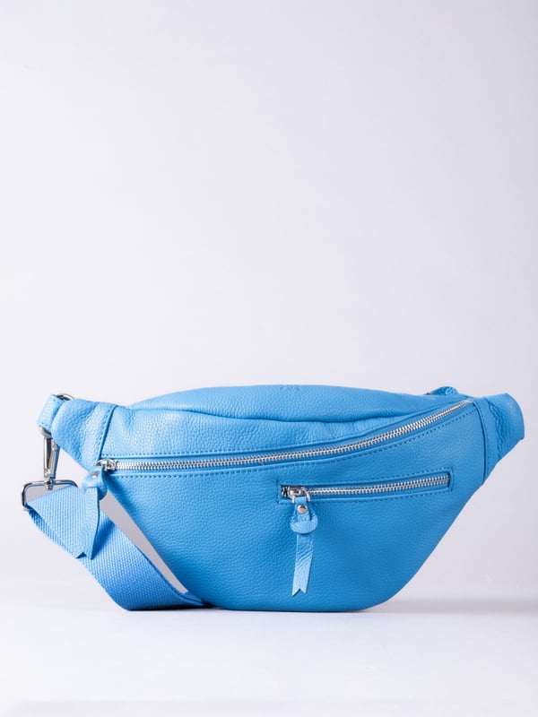 The Tarn Leather Sling Bag is a compact versatile style crafted from textured leather, designed for on-the-go. Boasting exterior zipped pockets as well as a main zipped compartment, there&rsquo;s plenty of places to organise your small essentials. The D-ring attachment on the comfy adjustable canvas strap allows you to easily wear this as a belt bag or cross body bag as you prefer. Adventure in style!