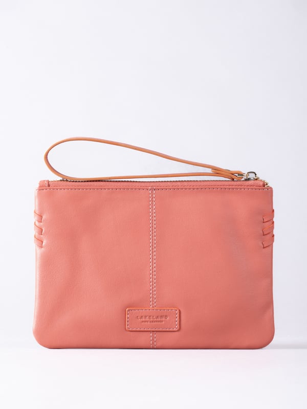 Compact, stylish, and effortlessly functional, the Tarnly purse pouch is designed for everyday ease. Crafted from supple leather, it features a refined front logo emboss and whipstitch detailing along the sides for a touch of artisanal charm. The zip-top closure is finished with a sleek leather wrist strap, making it perfect for carrying solo or slipping into a larger bag. Inside, a satin-lined interior offers thoughtful organisation with a slip pocket and three card slots, while built-in RFID protection keeps your essentials secure.&nbsp;