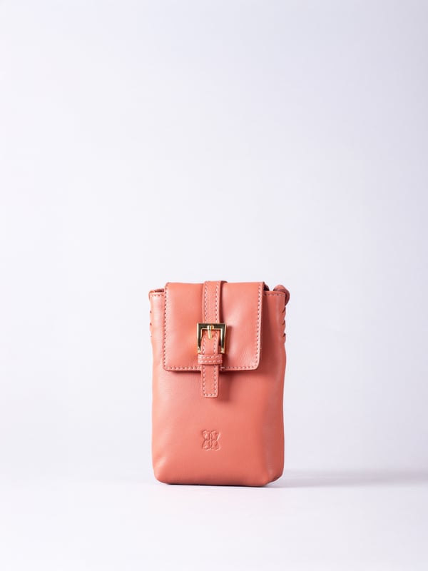 Small in size, big on style - the Tarnly phone pouch is the perfect hands-free companion for life on the move. Crafted from real leather with a soft satin lining, this compact cross-body features a flapover design secured with a magnetic press-stud fastening and finished with a decorative front buckle detail. Side stitch accents add a subtle crafted touch, while a rear zip pocket offers easy access to essentials. With an adjustable strap for the perfect fit, Tarnly keeps your phone and small valuables close in effortless style.