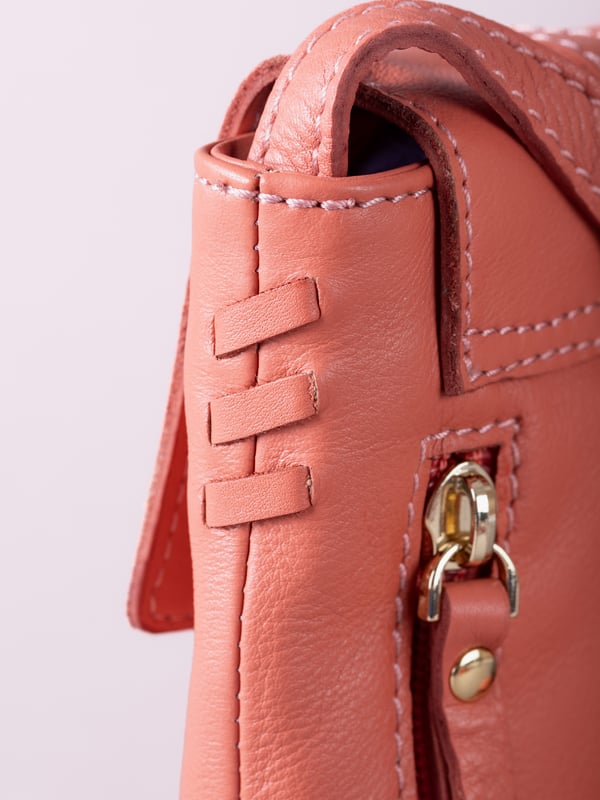 Small in size, big on style - the Tarnly phone pouch is the perfect hands-free companion for life on the move. Crafted from real leather with a soft satin lining, this compact cross-body features a flapover design secured with a magnetic press-stud fastening and finished with a decorative front buckle detail. Side stitch accents add a subtle crafted touch, while a rear zip pocket offers easy access to essentials. With an adjustable strap for the perfect fit, Tarnly keeps your phone and small valuables close in effortless style.
