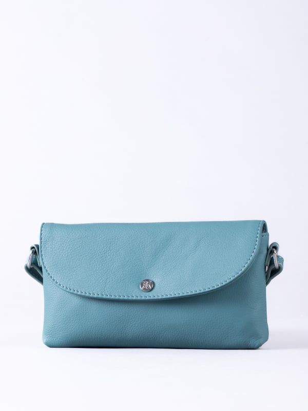 Streamlined, stylish, and just the right size, the Tawns bag is your go-to for those essentials you can&rsquo;t leave home without.
Compact yet practical, this mini cross body bag is perfectly sized for your phone, keys, and other small must-haves. Crafted from real leather for a touch of understated luxury, it features a secure flapover press-stud fastening and an adjustable strap for the perfect fit.
With a soft fabric lining to protect your items, the Tawns is as functional as it is effortlessly chic.