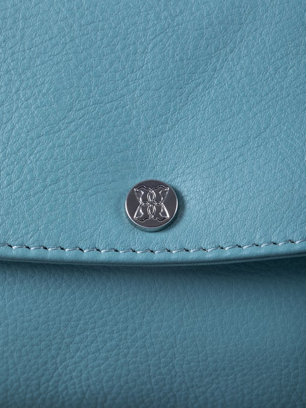 Streamlined, stylish, and just the right size, the Tawns bag is your go-to for those essentials you can&rsquo;t leave home without.
Compact yet practical, this mini cross body bag is perfectly sized for your phone, keys, and other small must-haves. Crafted from real leather for a touch of understated luxury, it features a secure flapover press-stud fastening and an adjustable strap for the perfect fit.
With a soft fabric lining to protect your items, the Tawns is as functional as it is effortlessly chic.