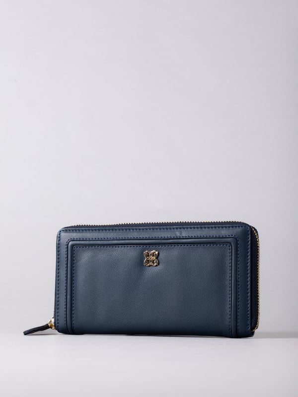 This large purse with handy zip around fastening is a must-have handbag accessory this season and beyond. Crafted from smooth leather, this purse contains ample storage for all your spending essentials including plenty of card slots, slip pockets and a zipped coin pocket. Finished with RFID protection to keep your cards electronically secure.