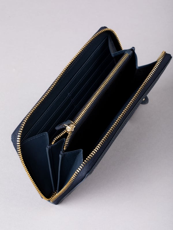 This large purse with handy zip around fastening is a must-have handbag accessory this season and beyond. Crafted from smooth leather, this purse contains ample storage for all your spending essentials including plenty of card slots, slip pockets and a zipped coin pocket. Finished with RFID protection to keep your cards electronically secure.