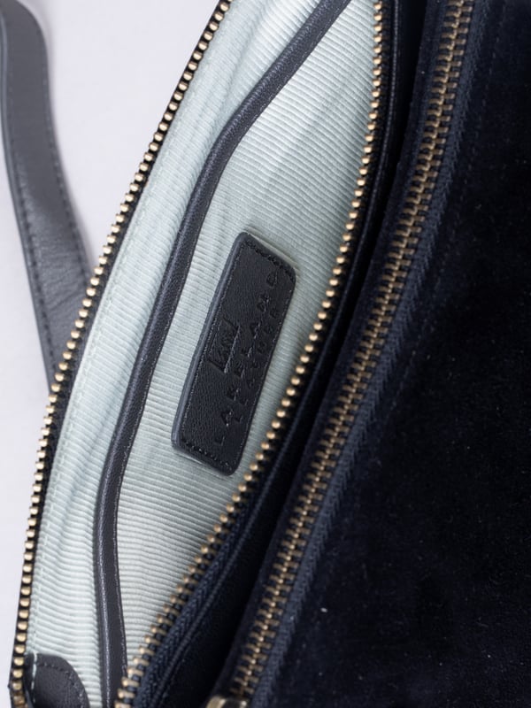 The Bridge twin cross body bag combines timeless style with practical design, making it a must-have for any wardrobe. Expertly crafted from real leather and suede, this versatile bag features a striking front suede compartment for added texture and interest. It also features an adjustable cross-body strap, offering a comfortable and customizable fit for hands-free wear.
With twin zip compartments &mdash; one smooth leather and one soft suede &mdash; there&rsquo;s ample space to keep essentials organized, while the interior slip pocket ensures smaller items stay secure. Finished with a ribbed fabric lining and available in three elegant colours, the Bridge bag is your go-to accessory for refined everyday style.