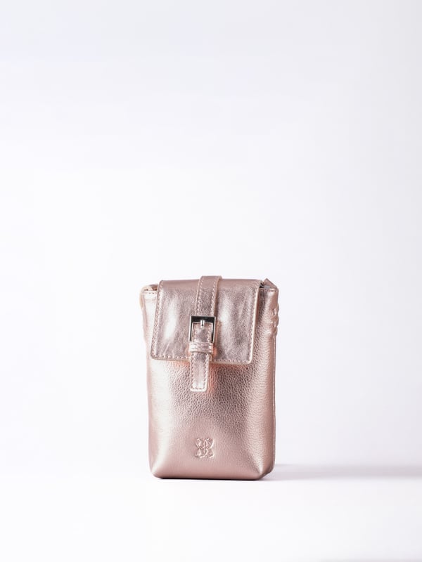 Small in size, big on style - the Tarnly phone pouch is the perfect hands-free companion for life on the move. Crafted from real leather with a soft satin lining, this compact cross-body features a flapover design secured with a magnetic press-stud fastening and finished with a decorative front buckle detail. Side stitch accents add a subtle crafted touch, while a rear zip pocket offers easy access to essentials. With an adjustable strap for the perfect fit, Tarnly keeps your phone and small valuables close in effortless style.