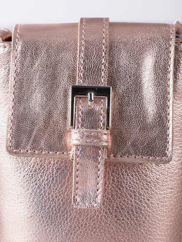 Small in size, big on style - the Tarnly phone pouch is the perfect hands-free companion for life on the move. Crafted from real leather with a soft satin lining, this compact cross-body features a flapover design secured with a magnetic press-stud fastening and finished with a decorative front buckle detail. Side stitch accents add a subtle crafted touch, while a rear zip pocket offers easy access to essentials. With an adjustable strap for the perfect fit, Tarnly keeps your phone and small valuables close in effortless style.