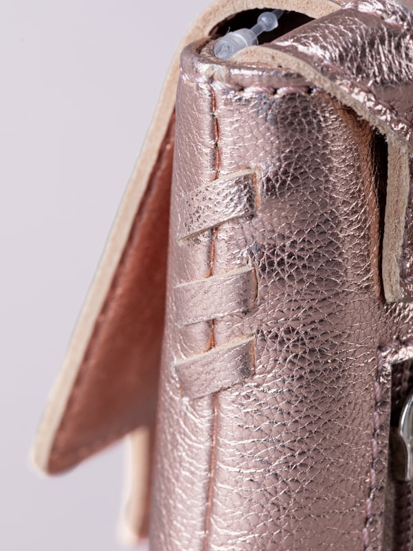 Small in size, big on style - the Tarnly phone pouch is the perfect hands-free companion for life on the move. Crafted from real leather with a soft satin lining, this compact cross-body features a flapover design secured with a magnetic press-stud fastening and finished with a decorative front buckle detail. Side stitch accents add a subtle crafted touch, while a rear zip pocket offers easy access to essentials. With an adjustable strap for the perfect fit, Tarnly keeps your phone and small valuables close in effortless style.