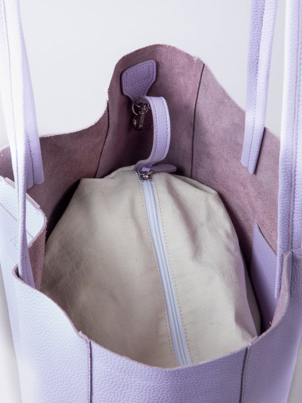 For relaxed leather luxury, look no further than the Tarn Bucket Bag in soft lilac. This spacious tote style bag will effortlessly take you through the working week into the weekend with plenty of room for a laptop and notebooks or shopping if you&rsquo;re hitting the high street.
Crafted from real leather in a contemporary slouchy design, this bucket bag is fitted with a popper fastened top and conceals a handy inner cloth bag with zip top opening to keep your valuables extra safe. This cloth bag is securely clipped to a leather strap and is removable for ultimate versatility.