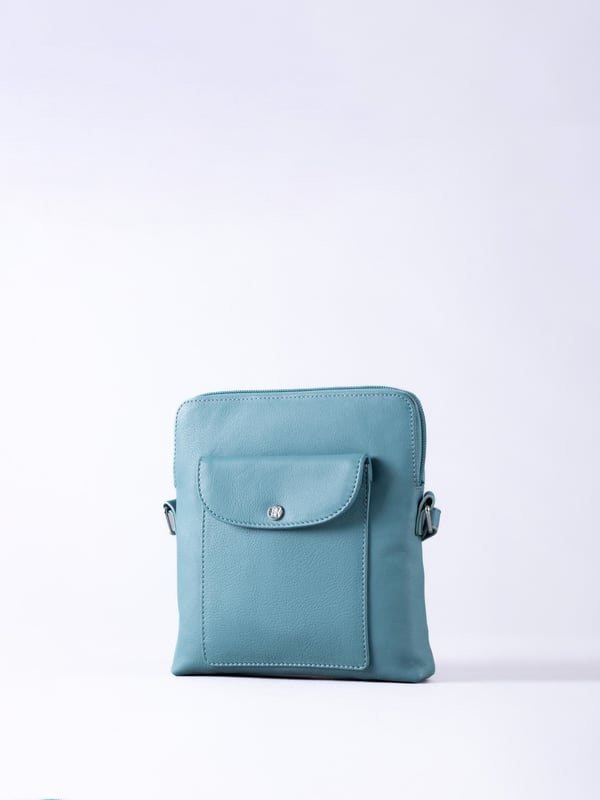The Tirrill cross body bag combines timeless design with practical functionality. Made from real leather, it&rsquo;s a versatile addition to your wardrobe, ideal for both day-to-day wear and special outings.
The adjustable cross-body strap allows for a customizable fit, while the flapover press-stud front pocket keeps your essentials close at hand. Inside, you'll find zip and slip pockets, perfect for organizing your belongings, all finished with a fabric lining for added refinement.
The Tirrill bag is compact yet spacious enough for all your daily must-haves, making it the perfect portable companion.
