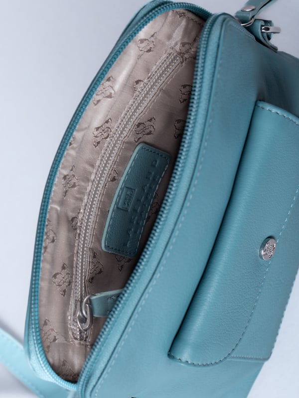 The Tirrill cross body bag combines timeless design with practical functionality. Made from real leather, it&rsquo;s a versatile addition to your wardrobe, ideal for both day-to-day wear and special outings.
The adjustable cross-body strap allows for a customizable fit, while the flapover press-stud front pocket keeps your essentials close at hand. Inside, you'll find zip and slip pockets, perfect for organizing your belongings, all finished with a fabric lining for added refinement.
The Tirrill bag is compact yet spacious enough for all your daily must-haves, making it the perfect portable companion.