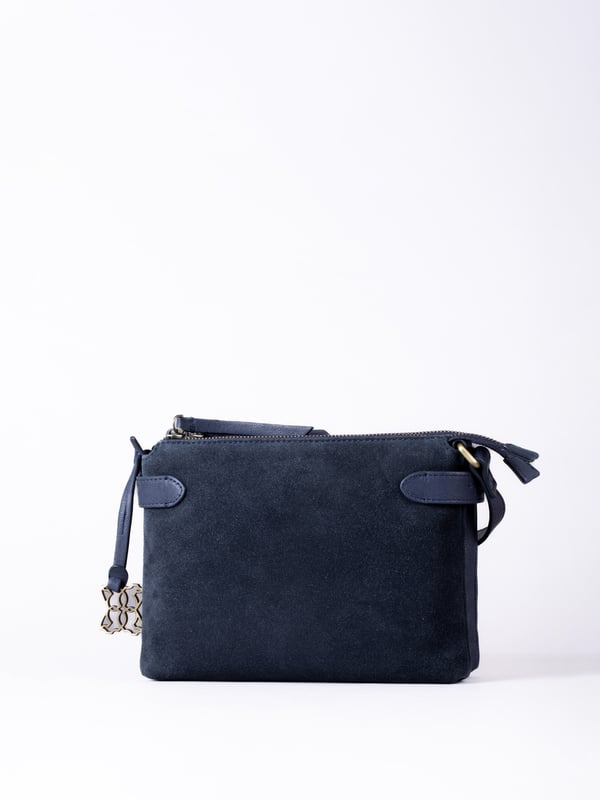 The Bridge twin cross body bag combines timeless style with practical design, making it a must-have for any wardrobe. Expertly crafted from real leather and suede, this versatile bag features a striking front suede compartment for added texture and interest. It also features an adjustable cross-body strap, offering a comfortable and customizable fit for hands-free wear.
With twin zip compartments &mdash; one smooth leather and one soft suede &mdash; there&rsquo;s ample space to keep essentials organized, while the interior slip pocket ensures smaller items stay secure. Finished with a ribbed fabric lining and available in three elegant colours, the Bridge bag is your go-to accessory for refined everyday style.