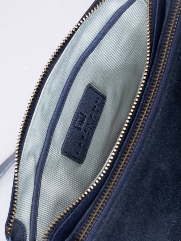 The Bridge twin cross body bag combines timeless style with practical design, making it a must-have for any wardrobe. Expertly crafted from real leather and suede, this versatile bag features a striking front suede compartment for added texture and interest. It also features an adjustable cross-body strap, offering a comfortable and customizable fit for hands-free wear.
With twin zip compartments &mdash; one smooth leather and one soft suede &mdash; there&rsquo;s ample space to keep essentials organized, while the interior slip pocket ensures smaller items stay secure. Finished with a ribbed fabric lining and available in three elegant colours, the Bridge bag is your go-to accessory for refined everyday style.