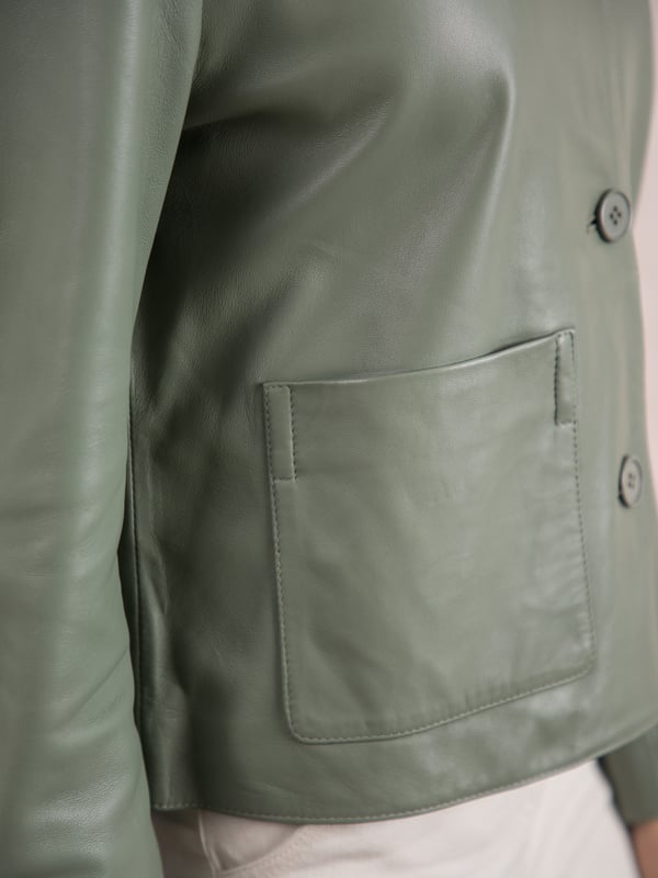 Kendal Collared Leather Jacket in Sage Green The minimally styled Kendal leather jacket will add understated elegance to all your outfits. Crafted from real leather in a boxy fit, this collared jacket features tonal buttons and large patch pockets for a unique look. Wear it buttoned up with your favourite trousers or open over a dress, the options are endless.