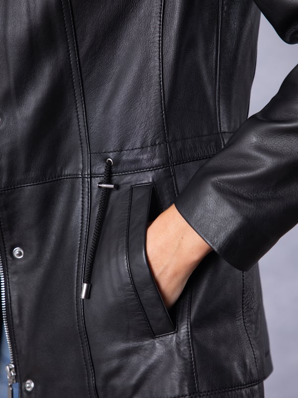 Levens Leather Field Jacket in Black The Levens field jacket, crafted in sumptuously soft UK-sourced black leather, is designed to protect you from the elements and keep you looking stylish.This jacket features a funnel neck drawstring collar and front pockets, as well as a drawstring waist so it can be worn cinched in or left loose. Its longer length and centre zip fastening with added front placket provides added protection from the great British weather, and equally serves to flatter your form.
