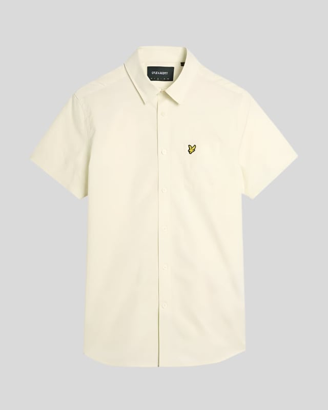 Introducing the Plain Poplin Short Sleeve Shirt from our Legacy collection, designed for the discerning man who appreciates sophistication and comfort. This shirt combines timeless elegance with a relaxed fit, making it an essential addition to the modern wardrobe. Its refined poplin fabric offers a breathable experience, suitable for both casual and formal occasions.

- Composition: 100% Cotton for unparalleled comfort
- Fit: Regular, tailored for ease of movement
- Logo Branding: Discreetly positioned for understated style
- Versatility: Ideal for layering or wearing solo

Elevate your spring menswear collection with this classic piece, blending style and functionality effortlessly.